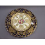 Royal Worcester cabinet plate with floral painted centre panel, signed E. Phillips