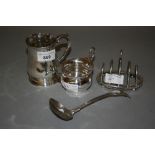 Small George III silver baluster form mug, silver jug, four division silver toast rack and a