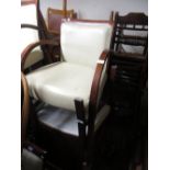 Group of seven 20th Century simulated cream leather upholstered open armchairs