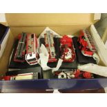 Box containing a collection of various die-cast model vehicles of fire engines
