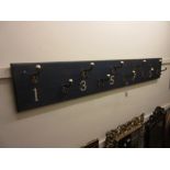Set of ten 19th Century gilt and porcelain mounted coat hooks mounted on a blue painted moulded