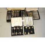 Cased set of six Sheffield silver and mother of pearl tea knives, two cased sets of silver teaspoons
