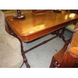 19th Century mahogany library table having plain top with moulded frieze, having two drawers bearing