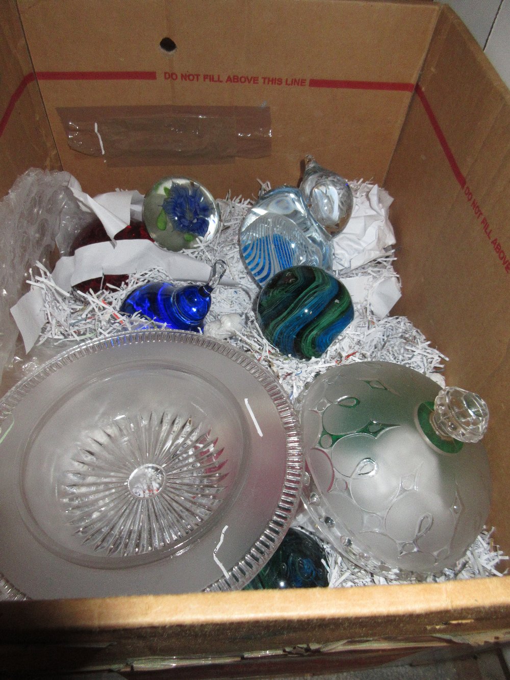 Group of ten various glass paperweights and a moulded glass dish and cover