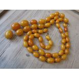 Quantity of butterscotch amber beads strung into two necklaces 206g