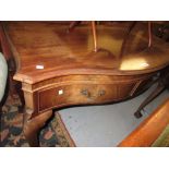 Mahogany serving table circa 1920, the moulded serpentine top above two drawers on cabriole claw and