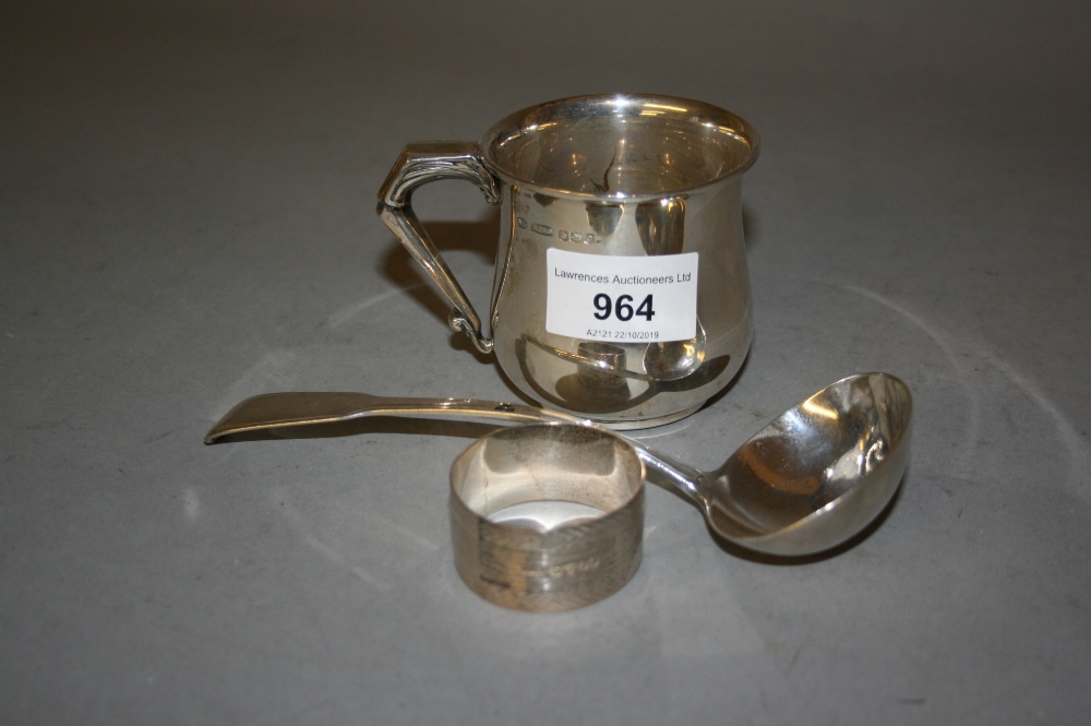 Sheffield silver Christening mug, a silver napkin ring and a 19th Century silver ladle