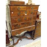 Antique walnut chest on stand, the moulded top above two short and three long graduated drawers with