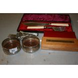 Pair of London silver and turned wooden glass coasters, a silver sugar sifter spoon, four items of