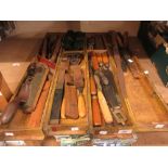 Combination brass mounted wooden carpenter's plane set with various blades and moulds, together with