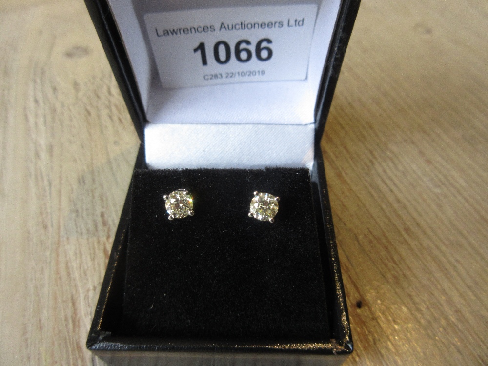 Pair of 18ct white gold diamond ear studs, approximately 1.05cts total