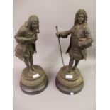 Pair of 19th Century dark patinated spelter figures of gentlemen wearing 18th Century costume on