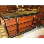 Victorian ebonised and gilt brass mounted dwarf breakfront bookcase, the moulded top above