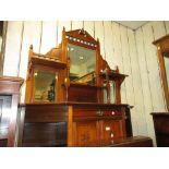 Late Victorian walnut chiffonier in Aesthetic style with a mirrored shelf back above a drawer,