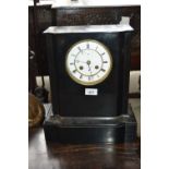 19th Century French black slate mantel clock, the circular enamel dial with Roman numerals,