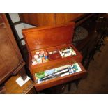 Two mahogany work boxes containing a quantity of sewing related items