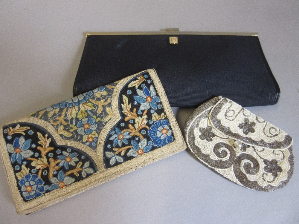Christian Dior clutch bag together with an embroidered clutch bag and a bead work purse