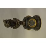 19th Century French black slate dark patinated and gilt bronze mounted mantel clock, the cylindrical