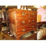 19th Century mahogany chest of two short over two long drawers with oval brass handles raised on