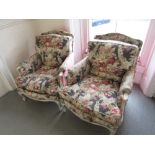 Pair of French open arm drawing room chairs with upholstered backs and overstuffed seats, painted