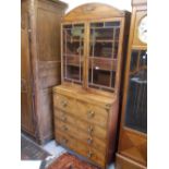 Regency mahogany secretaire bookcase, the dome shaped cornice above a pair of bar glazed doors,