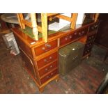 Reproduction yew wood twin pedestal desk with green leather inset top together with a reproduction