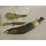 Indian kukri with bone and hardwood grip in a leather scabbard, a native stitched leather gourd