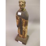 Antique Continental carved pine figure of a monk, mounted on a later base, 12.5ins high (at fault)