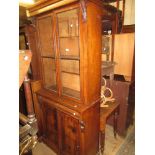 19th Century mahogany bookcase, the moulded top above two glazed doors enclosing adjustable