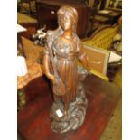 19th Century dark patinated bronzed figure of a woman playing a lute on a naturalistic base, 21ins