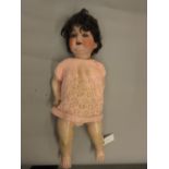 Heubach & Koppelsdorf, German bisque headed doll with sleeping eyes, open mouth and two teeth, the