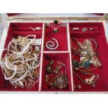 White jewellery box containing a quantity of various costume jewellery