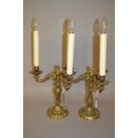 Pair of ornate cast brass three branch candelabra
