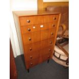 Mid 20th Century narrow chest of various drawers