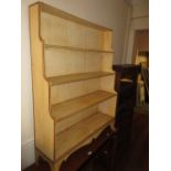 20th Century painted waterfall type open fronted bookcase on splay supports, 38ins wide, 48ins high,