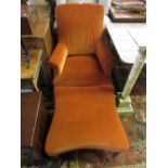 19th Century rust upholstered armchair with matching stool raised on turned tapering supports