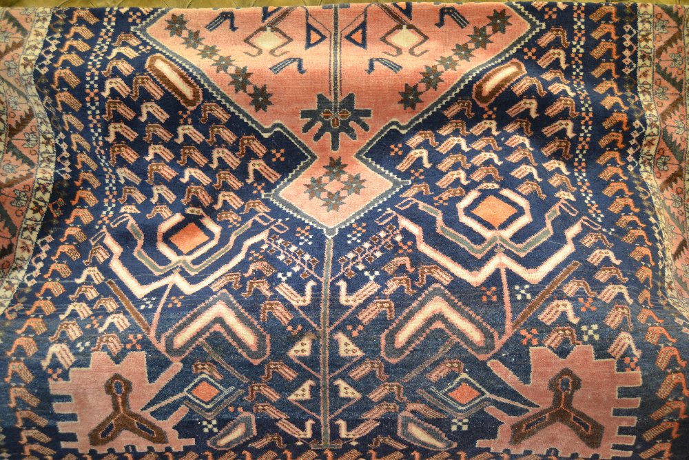 Afghan rug of triple medallion with multiple borders on a blue ground, 72ins x 45ins (at fault), - Image 2 of 3
