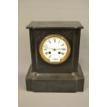 Small black slate two train mantel clock with pendulum