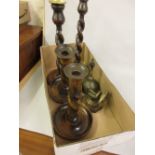 Two pairs of 1930's wooden candlesticks, a nutcracker in the form of a ships wheel and a brass bell