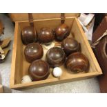 Boxed set of eight early 20th Century lignum vitae bowling woods