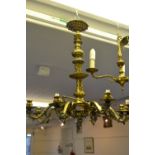 Cast brass eight branch chandelier 28ins All arms are loose (bolts need tightening). One is held