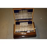 Oak cased set of twelve silver plated and mother of pearl dessert knives, together with two case