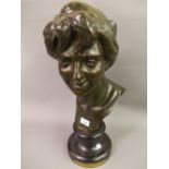 Jules Herbays patinated bronze bust of a young woman, signed in the bronze and mounted on a circular