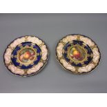 Two Royal Worcester plates painted with panels of fruit by Seabright (with damages)