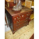 Mahogany dwarf chest with a brushing slide above four graduated drawers with brass handles raised on