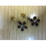 Pair of garnet set silver gilt daisy design drop earrings