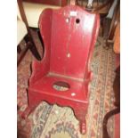 Antique red painted child's rocking / commode chair