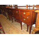 Mahogany sideboard in George III style, the brass rail back above two central doors surrounded by