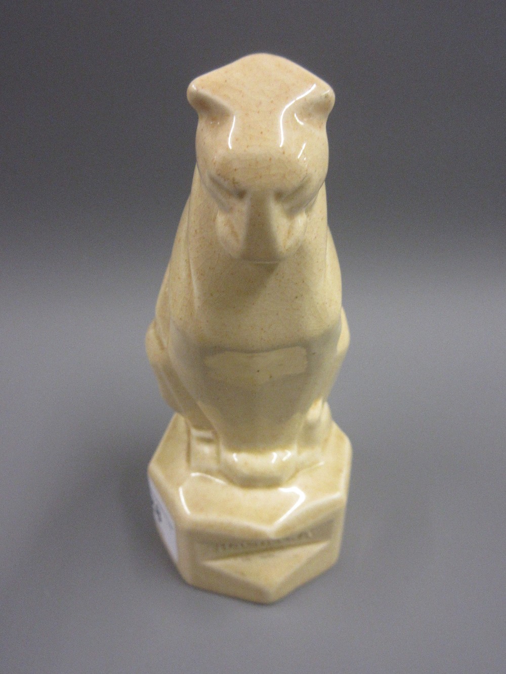 Ashtead Pottery figure ' Bagheera ' in the form of the seated Jungle Book character on a hexagonal