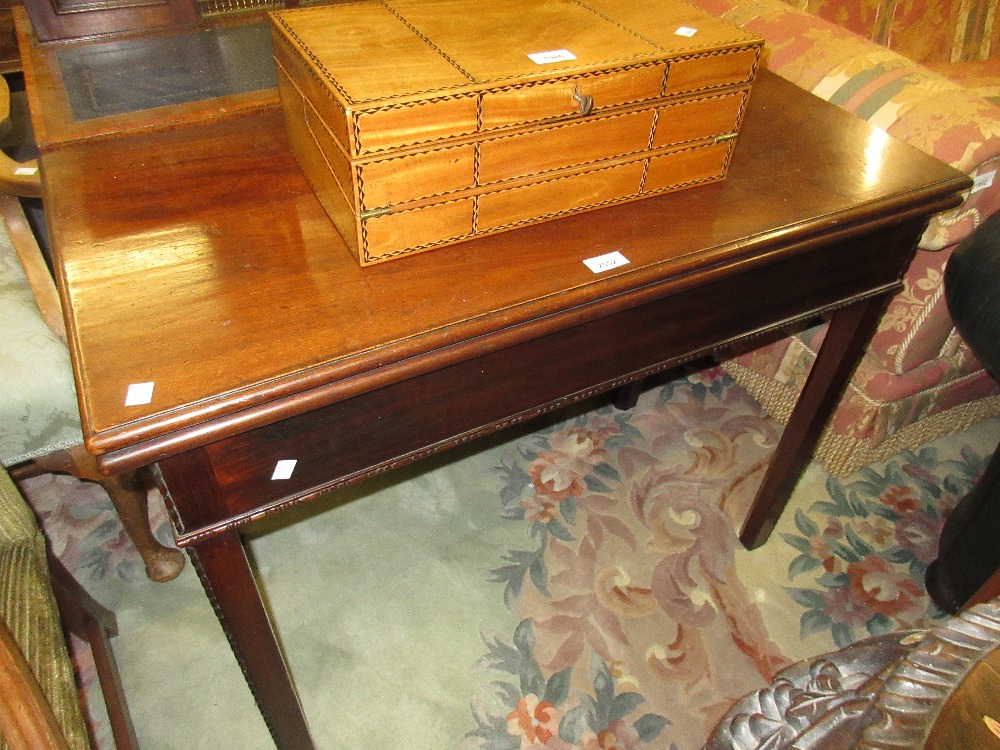 George III mahogany rectangular fold-over tea table on square cut chamfered supports with carved
